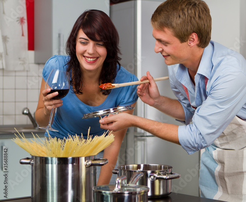 Photo: Happy young couple in the kitchen Happy young couple in the kitchen
