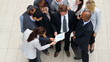 High angle view of multi racial business people discussing