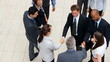 Multi ethnic business people shaking hands