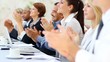 Multi ethn Business people applauding
