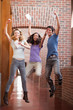 Portrait of successful students jumping