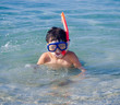 Photo: Swimming boy with snorkel mask in the sea Swimming boy with snorkel mask in the sea