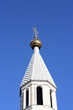 Golden dome of the Orthodox church in Central Russia on the blue