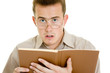 The man in glasses with a book.