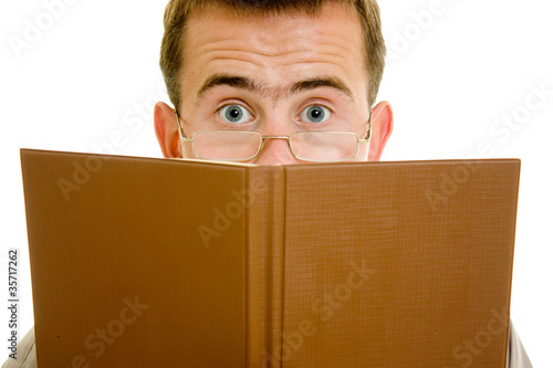 Photo: The man in glasses with a book. The man in glasses with a book.