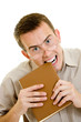 The man in glasses eats book.