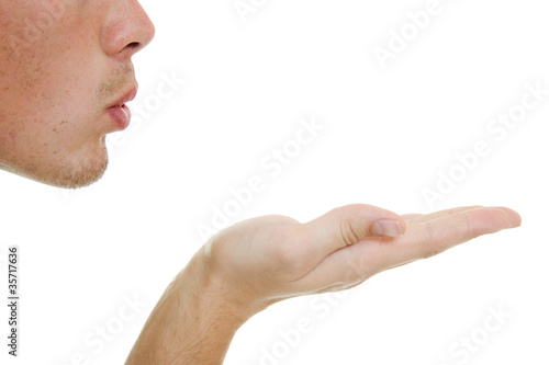 Photo: A man sends a air kiss. A man sends a air kiss.