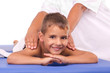 Photo: Smiling boy lying on the massage table Smiling boy lying on the massage table