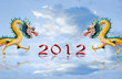 Dragons statue fly with 2012 number and nice cloudy sky Dragons statue fly with 2012 number and nice cloudy sky