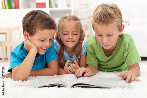 Photo: Kids practice reading together Kids practice reading together