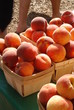 Stacks of fresh organic peaches at a Farmer's Market Stacks of fresh organic peaches at a Farmer's Market