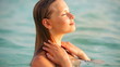 Portrait of sexy young woman enjoying in water