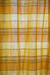Sunlight through yellow and orange curtain