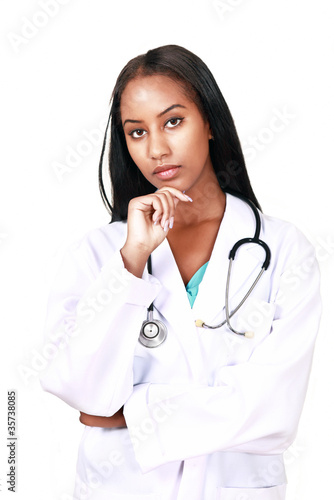 Photo: Ethnic female doctor with serious expression Ethnic female doctor with serious expression