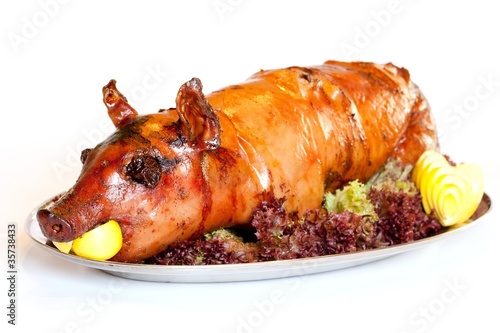Photo: Grilled suckling pig on a plate Grilled suckling pig on a plate