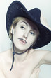 Naked women with mustache wearing cowboy hat