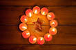 chirstmas candles circle over wood and symbol chirstmas candles circle over wood and symbol