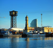 fishing ships and tower with hours per port of barcelona;  Port
