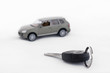 Keys and a car in the background