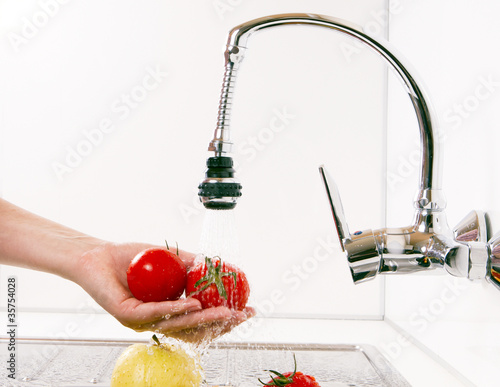 Photo: Apples and tomatoes prepared in the kitchen. Apples and tomatoes prepared in the kitchen.