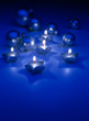 Art Christmas candles and ornaments on a blue background Art Christmas candles and ornaments on a blue background