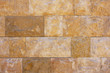 Wall of orange stone brick