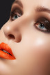 Glamourous woman face with fashion make-up. Sexy gloss makeup