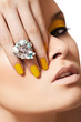 Model face with fashion make-up, big crystal ring. Disco makeup