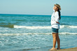 Woman on beach enjoying sun rays Woman on beach enjoying sun rays