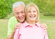 Portrait of smiling senior couple outdoors Portrait of smiling senior couple outdoors