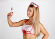 Young woman holding a syringe
