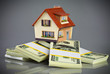 house on packs of banknotes
