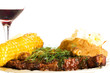 Grilled steak with corn, baked potato and red wine
