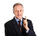 Smiling businessman pointing up