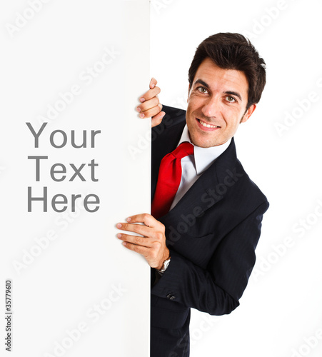 Photo: Businessman showing a blank board Businessman showing a blank board