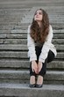 Young beautiful girl sitting on stairs Young beautiful girl sitting on stairs