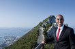 A business man on top of the world A business man on top of the world