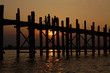 Teak bridge U Bain in Burma. Sunset, silhouettes.
