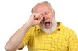 senior bald and bearded man is bored