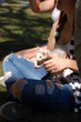 A girl holding ferrets