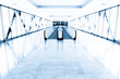 Blue glass corridor in office centre