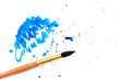 brush with blue paint stroke and stick