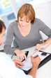 Car buyer sigining contract in office