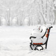 Red benches in the snow