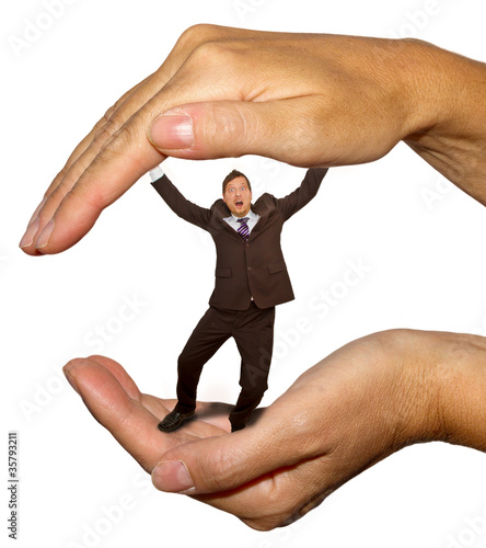 Photo: Businessman in the hand Businessman in the hand