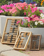 The abacus which is standing near a bed with flowers The abacus which is standing near a bed with flowers