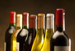 Wine bottles in a row with limited depth of field