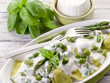 ravioli stuffed with ricotta and basil garnish with cream and as
