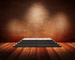 grunge interior with a highlighted podium. grunge interior with a highlighted podium.