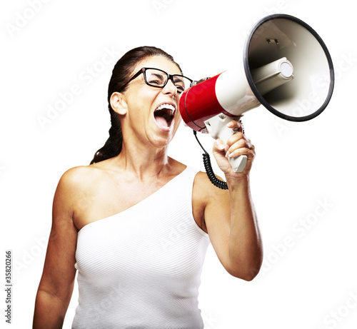 Photo: woman shouting using megaphone woman shouting using megaphone